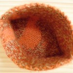 knitted vessel in peach and flecked yarn